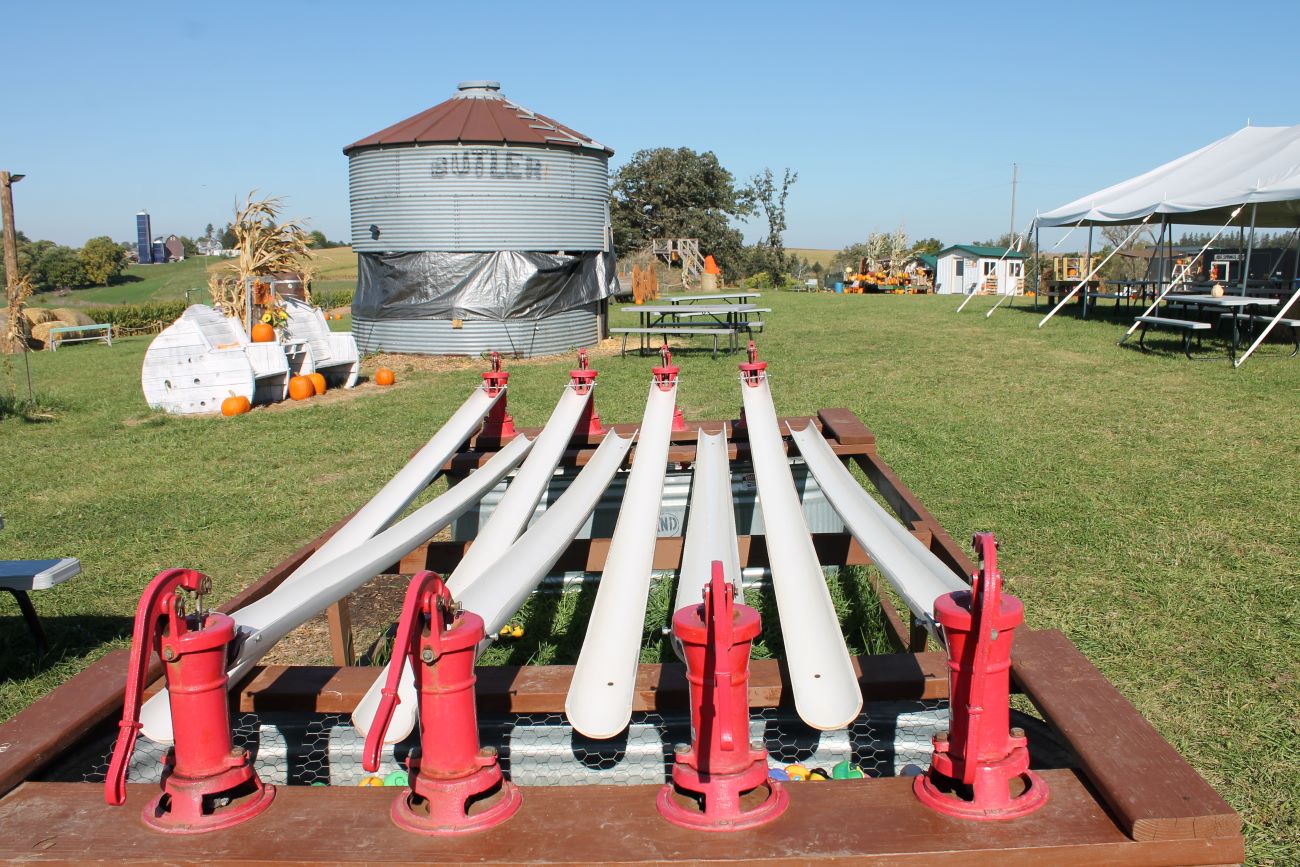 Red handled water pumps with white plastic runs for rubbery ducky races.