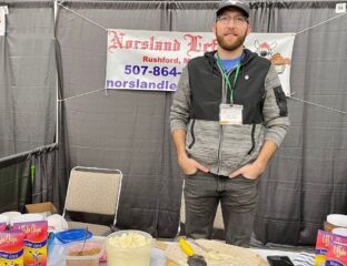 Zach Lind, General Manager of Norsland Lefse, mans the company booth at a recent FEAST event in Rochester.