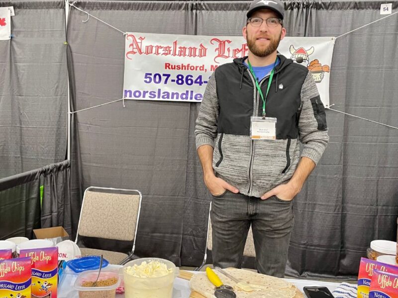 Zach Lind, General Manager of Norsland Lefse, mans the company booth at a recent FEAST event in Rochester.