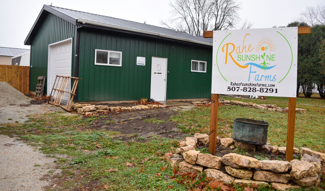 Behind the doors of this unassuming building near downtown Wykoff is a bountiful farm that produces acres of lettuce each year. The front is a reception/office area with the two semi trailers extending from the back of the street-facing building. 