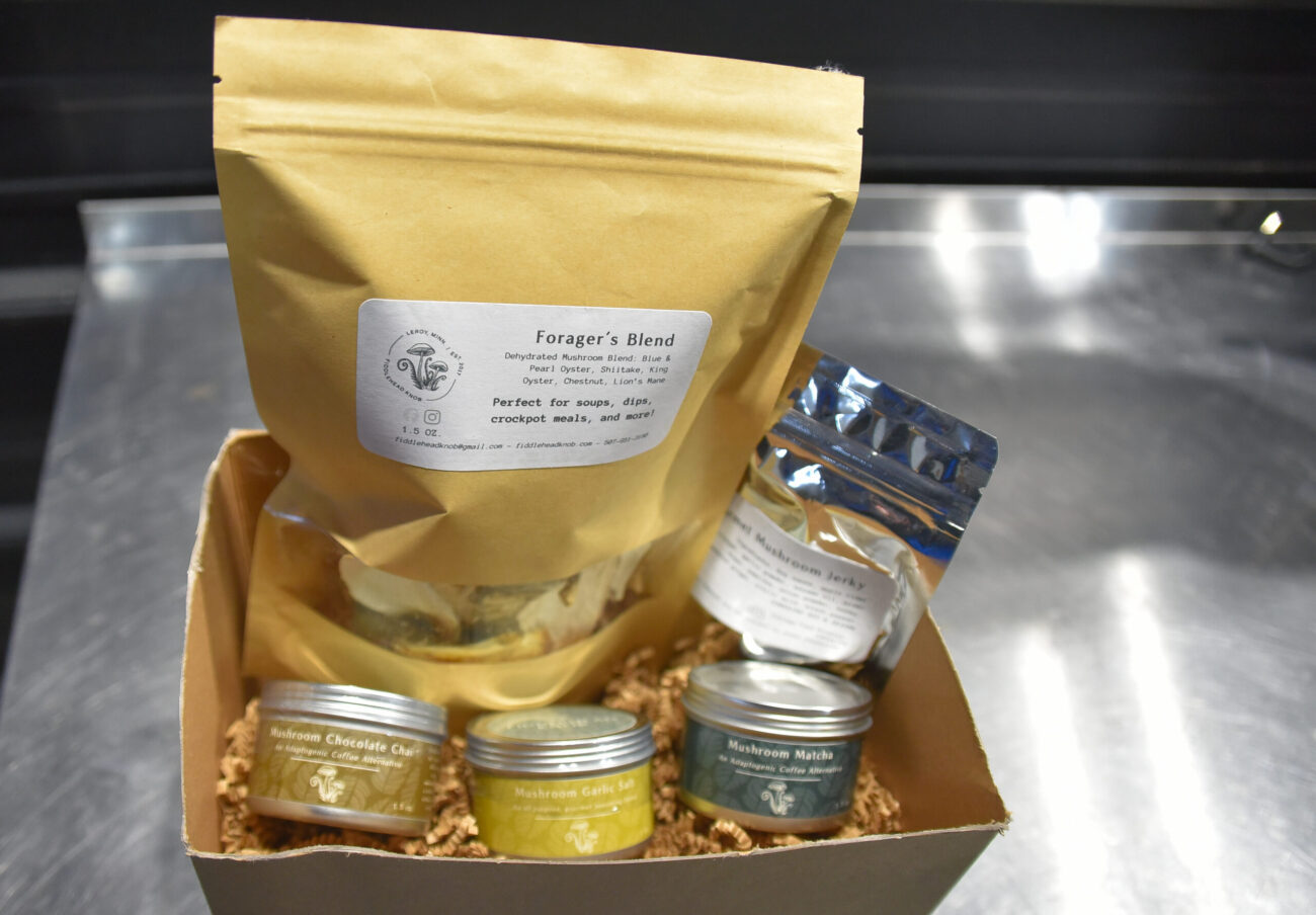 A cardboard box with jars and bags of products from Fiddlehead Knob Farms.