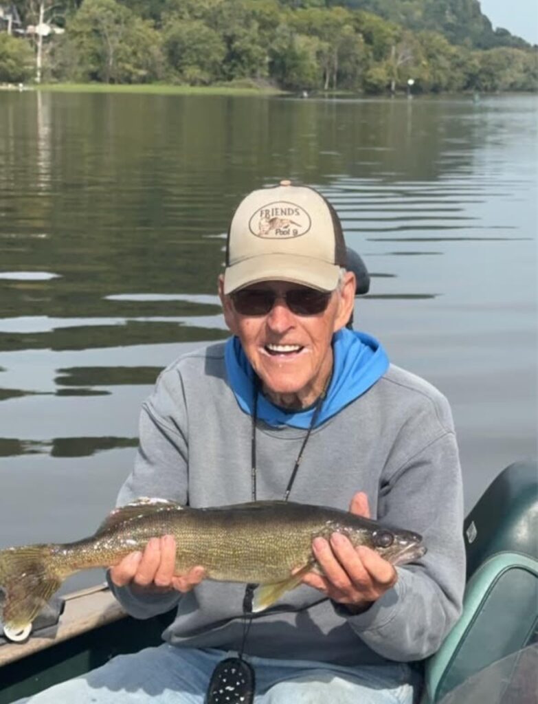 fisherman in a boat on the mississippi river