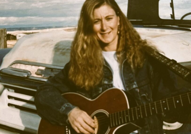 Ann Lowe guitar photo - 2b Guitars hold memories of Christmases past for singer/songwriter Ann Lowe, seen here with one of those special gifts from days gone by. (Submitted photo)