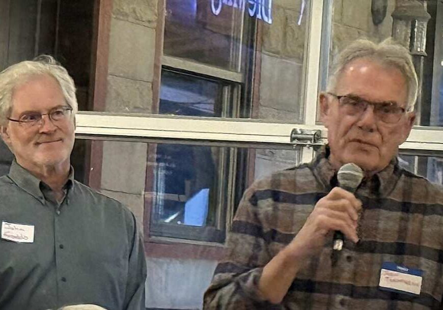 two men in front of audience