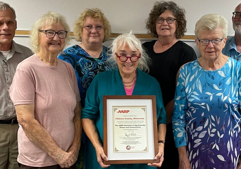 Fillmore County became a member of the AARP Network of Age-Friendly States and Communities. Pictured Front Row:  Bonnie Heidtke (Wykoff), Linda King (Mabel), Marge Fuller (Lanesboro); Back Row:  Dan Conway (Southeast Area Agency on Aging), Sue Olinger (Harmony), Pam Nelson (Chatfield), and Bill Sullivan (Pilot Mound). (Photo by Brenda Pohlman)