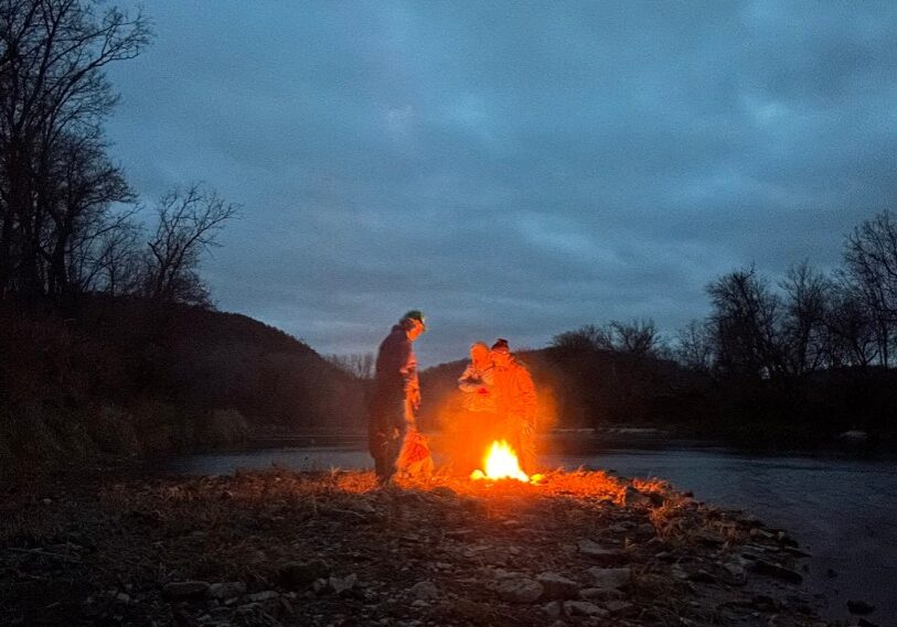 PHOTO 1 CAMPFIRE "...a flowing stream, a crackling fire..." foster companionship along the Root River. (Photo by John Gaddo)