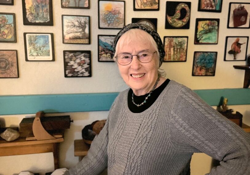 Diane Knight is pictured in front of a wall of Doodles – intricate pen and ink designs that she creates.  (Photo by Renee Bergstrom)