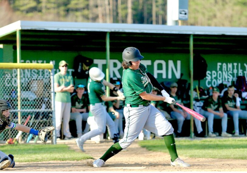 <span style="font-size: 14px; color: #6c6b6b;"><em>High School baseball is in full force during May.  In this picture, the batter makes contact with the baseball while the catcher is still poised to receive the pitch.  (Photo by Craig Johnson)</em> </span>