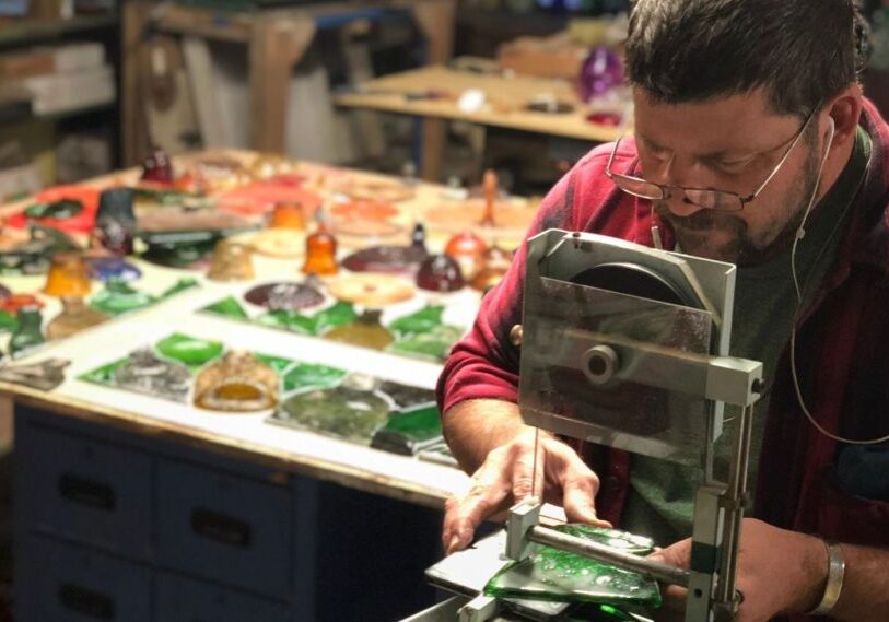 PHOTO 1 Karl Unnasch in Studio <span style="font-size: 14px; color: #6c6b6b; ">Karl Unnasch prepares a stained glass panel in his Pilot Mound studio. “Stained glass is a sneaky medium,” says artist Karl Unnasch, “a series of frozen brush strokes.” (Photo submitted by Karl Unnasch)</span>