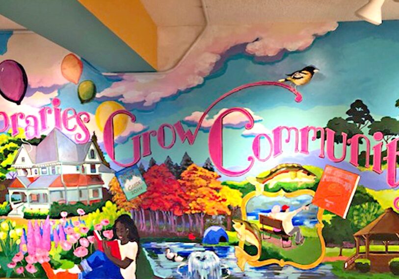 PHOTO 1 Lanesboro mural This "Libraries Grow Community" mural greets visitors to the Lanesboro Public Library. America's FIRST library was in Philadelphia, started by Ben Franklin in 1731. (Photo by Steve Harris)
