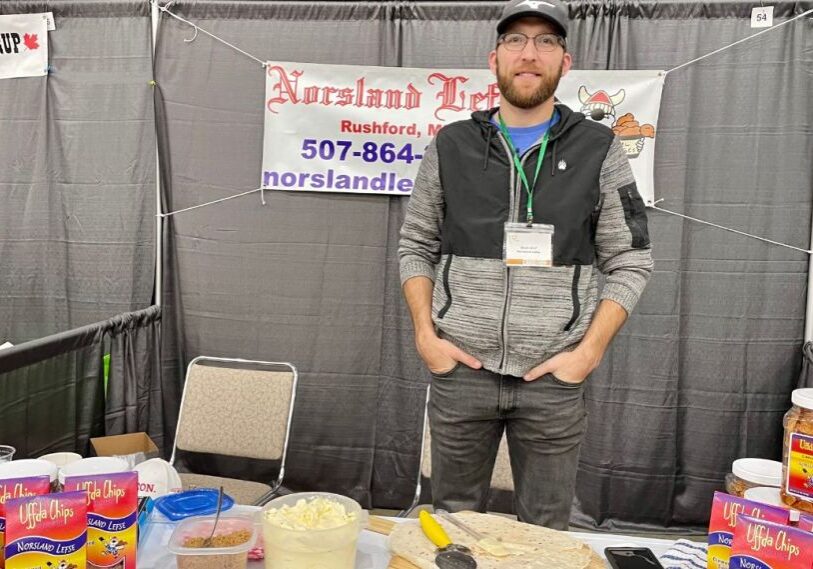 Zach Lind, General Manager of Norsland Lefse, mans the company booth at a recent FEAST event in Rochester.