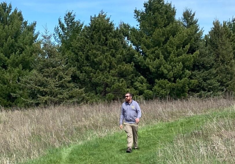 PHOTO 1 Marty Walsh walks on Lost Creek Trail Revised <span style="font-size: 14px; color: #6c6b6b; ">Marty Walsh, Lead Organizer of the Minnesota Driftless Hiking Trail, hikes along the beginning of Lost Creek Hiking Trail near Chatfield. (Photo by Julie Fryer)</span>