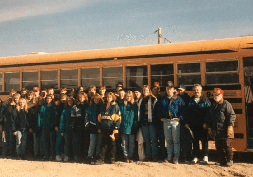 <span style="font-size: 14px; color: #6c6b6b; ">Each spring Maynard Underbakke, at right, would welcome students to tour his tree farm nursery. Each student was given a spruce seedling to plant at their home. (Photo submitted by Bonita Underbakke)</span>
