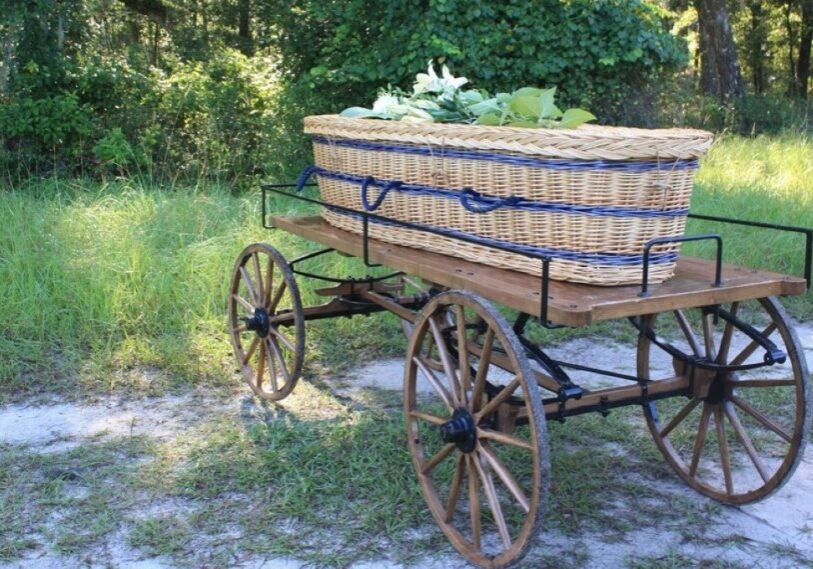 PHOTO 1 Prairie Creek Conservation Cemetery Gainesville FL Conservation Burial Alliance <span style="font-size: 14px; color: #6c6b6b; ">A wicker, biodegradable casket awaiting burial at the Prairie Creek Conservation Cemetery in Gainesville FL. (Photo courtesy of the Conservation Burial Alliance)</span>
