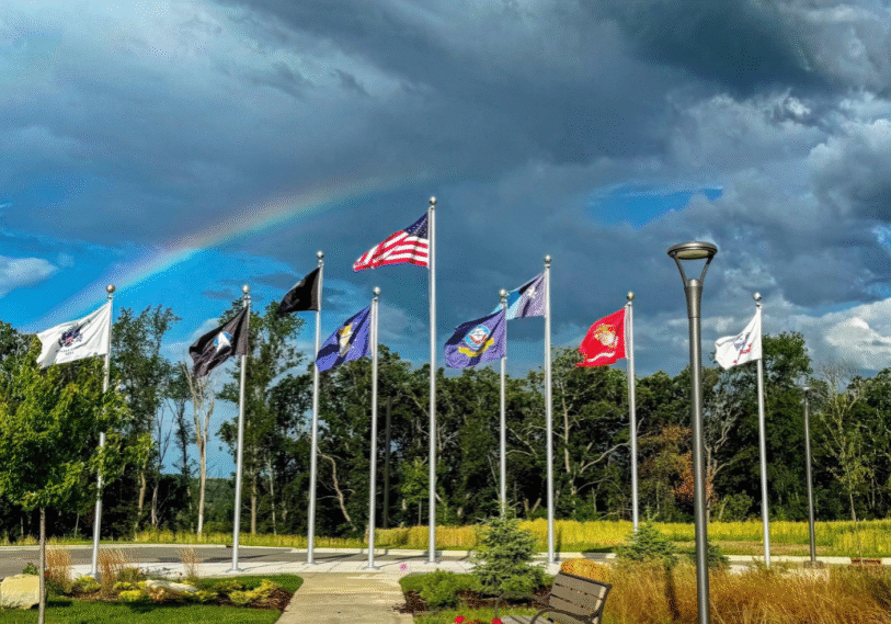 PHOTO 1 Rainbow over Veterans Home flags A rainbow arches over the recently dedicated Minnesota Veterans Home in Preston. In addition to its official dedication, the home has passed its first Certification Survey allowing it to welcome additional residents in the months ahead. (Photo provided by Rachel Lemmer)