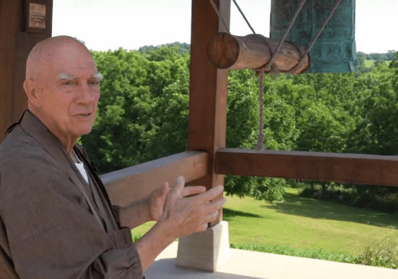 PHOTO 1 Rev. Shoken Winecoff <span style="font-size: 14px; color: #6c6b6b; ">Founding teacher and abbot Rev. Shoken Winecoff explains the significance of the bell at Ryumonji, a Soto Zen Buddhist temple located in the rolling hills just across the Minnesota-Iowa border southeast of Spring Grove (Houston County). (Photo courtesy of the Ryumonji Center)</span>