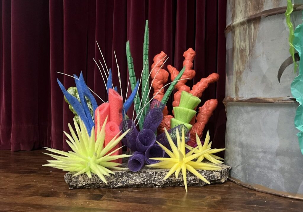 PHOTO-1-coral-reef-scaled <span style="font-size: 14px; color: #6c6b6b; ">A rolling coral reef ready to go on stage. (Photo by Laurie Byrne)</span>