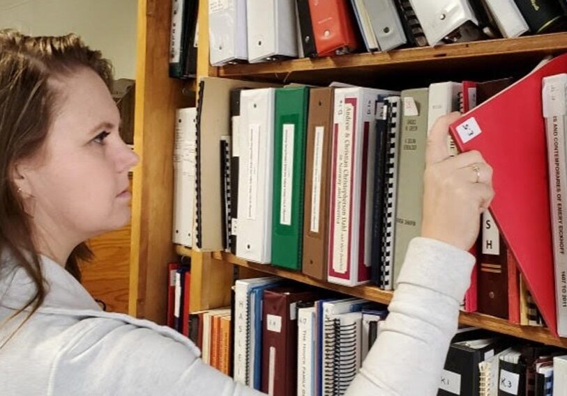 The Fillmore County Historical Society in Fountain has a vast collection of historical data. Former Executive Director Sara Sturgis is pictured here researching information for a society project. (Submitted photo)