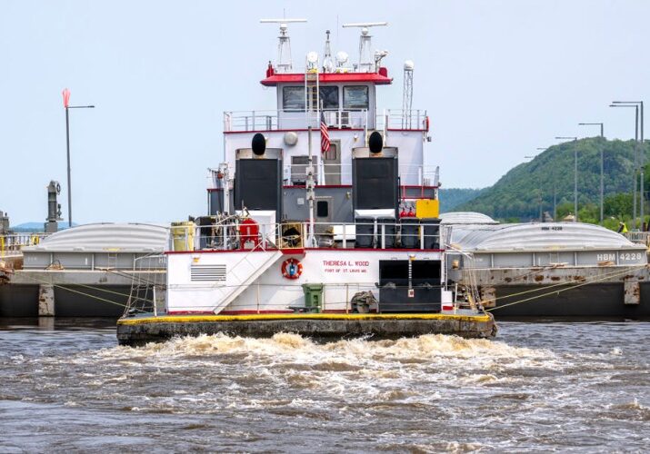 Photo-1-river-tug tug boat going through lock and dam