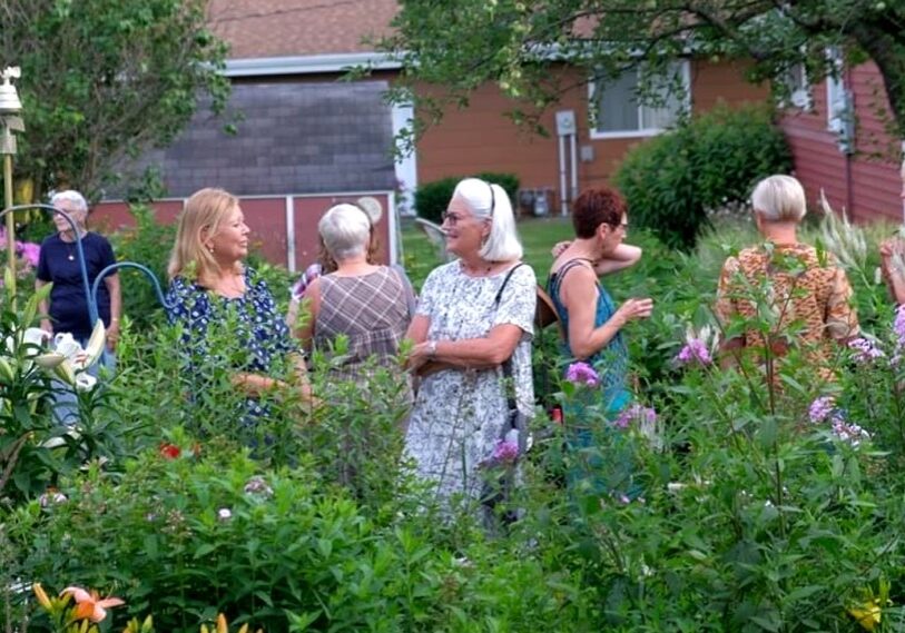 Members of the Harmony Garden Club attend their annual progressive dinner and garden tour.  (Photo by Loni Kemp)