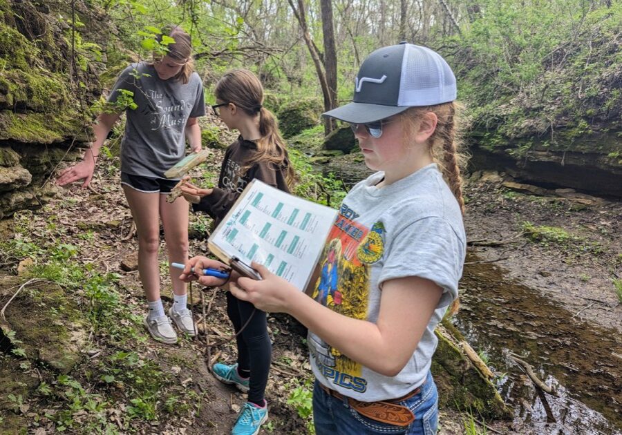 Primary PHOTO THREE girls Students study Karst geology on Eagle Bluff’s campus. Using simple tools of a geologist, they identify the chemical and physical properties of four different types of sedimentary rocks. (Photo submitted by Eagle Bluff)