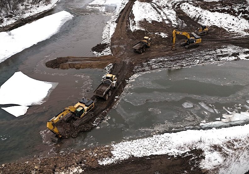 A drone view of machinery equipment working on the Root River rechanneling project.